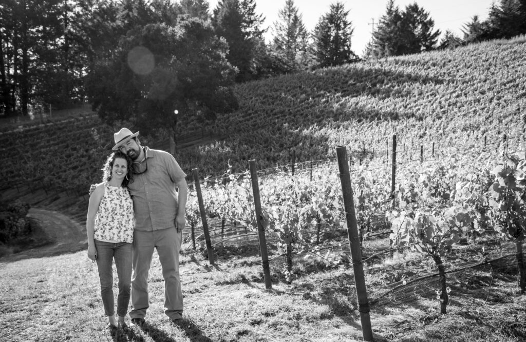 Robert and Recha Bergstrom standing together in the vineyard